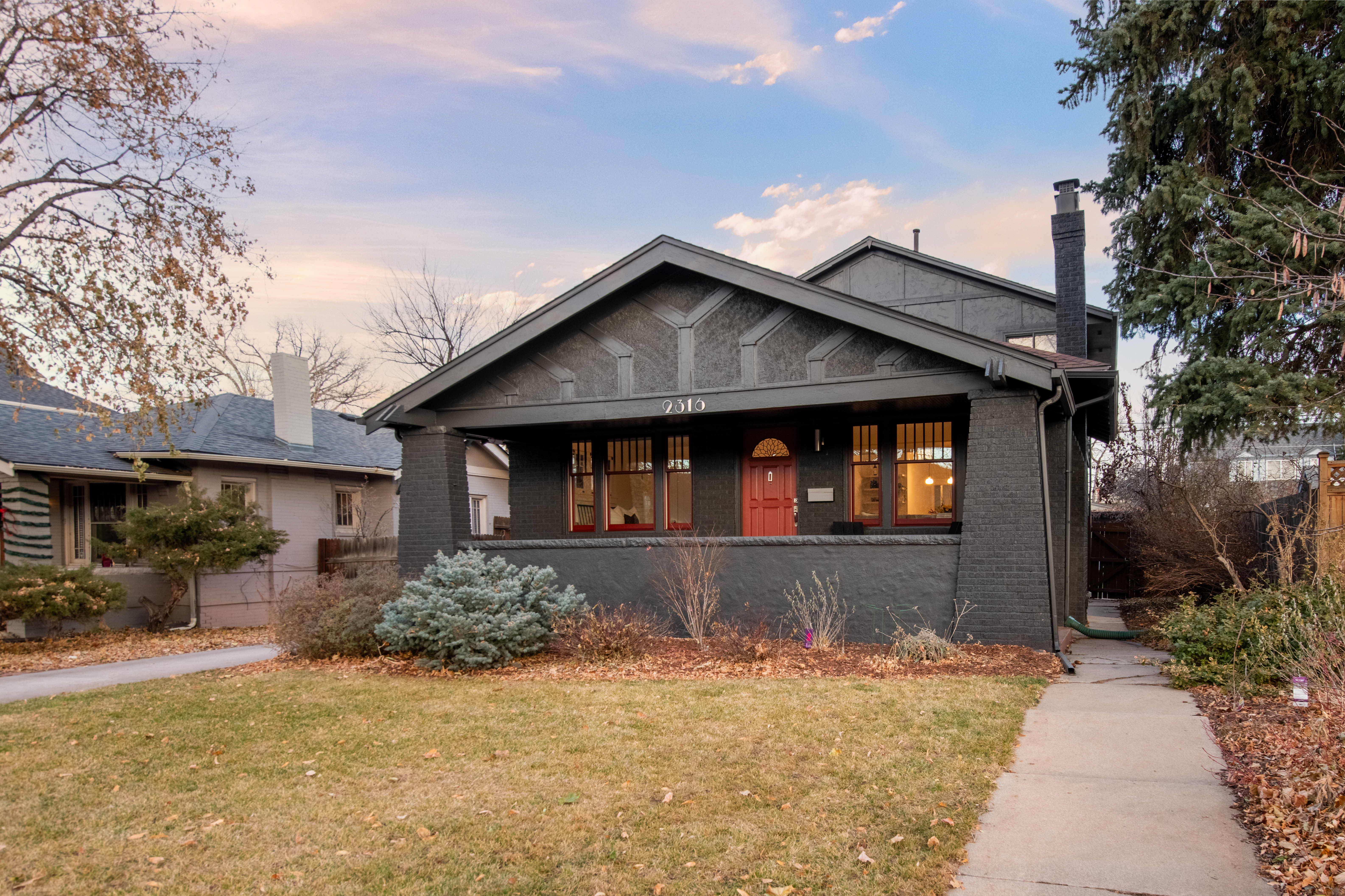 Front facade of a luxury Denver home at twilight